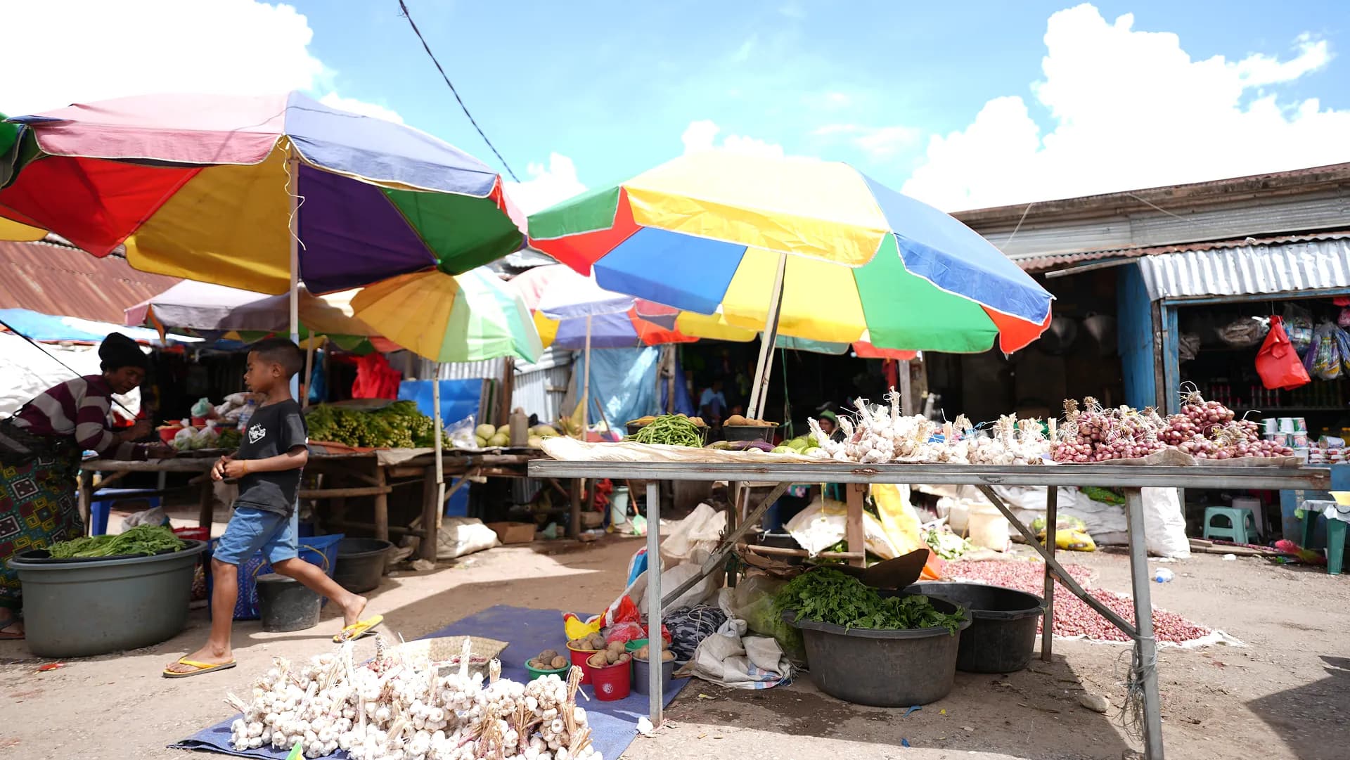 Maubisse market under rainbow umbrellas