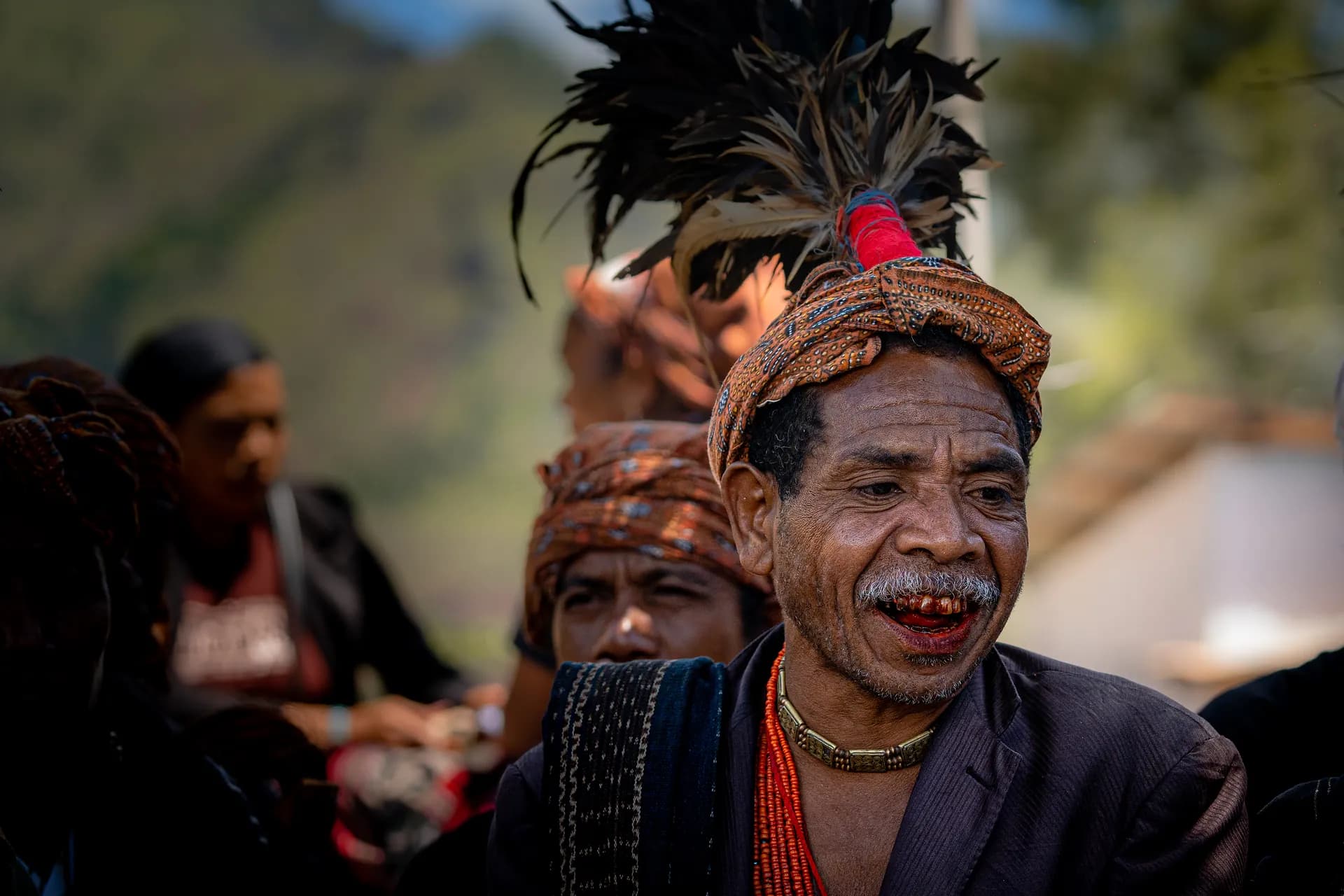An elder in a feathered headdress