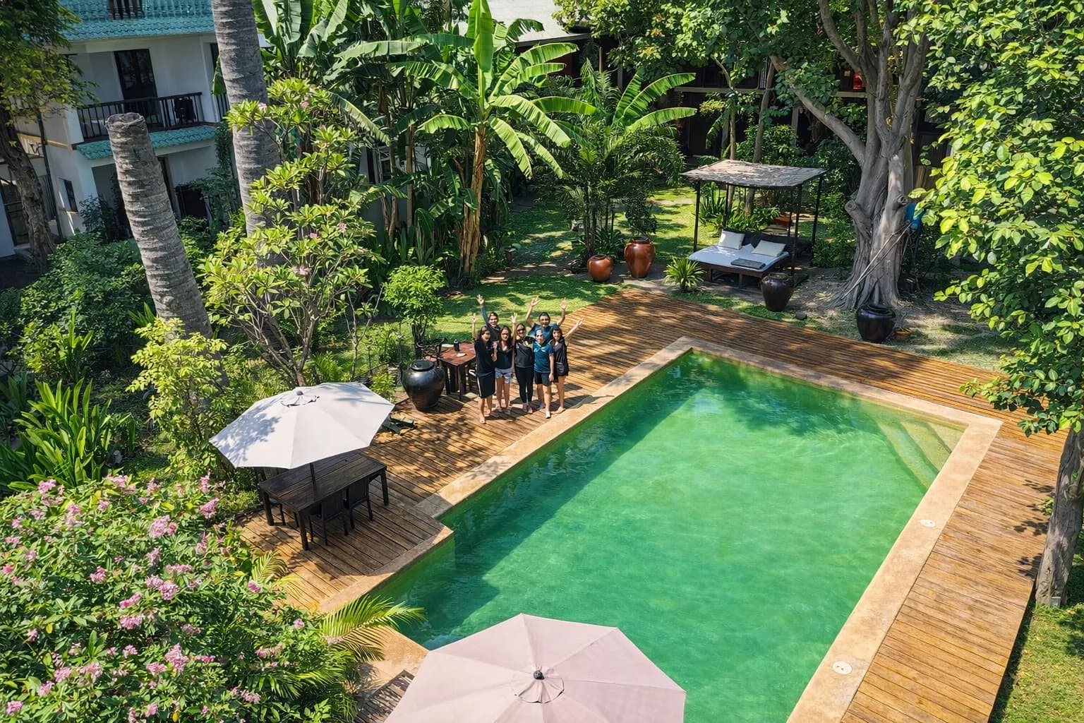 Aerial view of the pool deck and sun loungers at Hotel Esplanada Dili