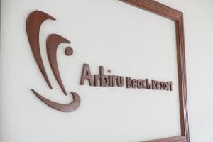 Arbiru Beach Resort branded plaque inside the lobby