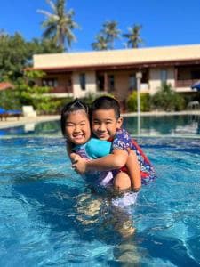 Arbiru Beach Resort children playing in the resort swimming pool