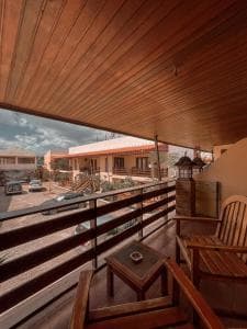 Arbiru Beach Resort timber balcony with view to courtyard and palms