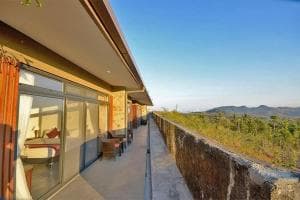 Balibo Fort Hotel covered terrace walkway with sweeping countryside view