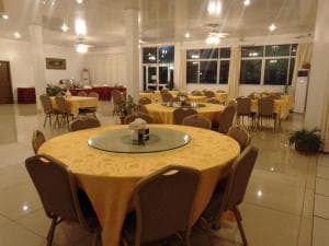 Beach Garden Hotel banquet dining hall with round tables and white linens