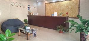 Beach Garden Hotel reception with bean-bag seating and feature wall