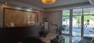 Beach Garden Hotel main lobby with reception desk and atrium windows