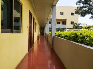 Chong Ti Hotel exterior corridor walkway with hedge planters