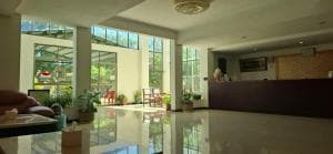 Excelsior Resort bright lobby with reception and atrium windows