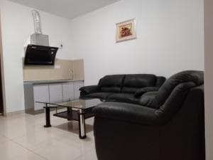 Excelsior Resort apartment with kitchenette, sofa and coffee table