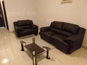 Excelsior Resort lounge with two leather sofas and glass coffee table