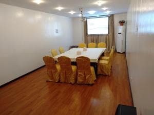 Excelsior Resort private dining room with rectangular table and yellow chairs