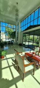 Excelsior Resort double-height lobby with chandelier and atrium windows