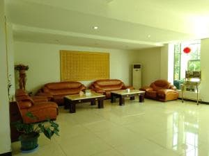 Excelsior Resort common lounge with armchairs around a feature wall
