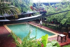 Hotel Esplanada outdoor swimming pool surrounded by tropical garden