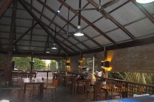 Hotel Esplanada open-air restaurant with hanging pendant lamps and timber tables