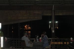 Hotel Esplanada poolside at night with city lights in the background