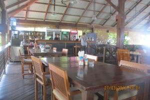 Hotel Esplanada open-air dining area with hanging lamps and timber tables