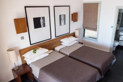 Hotel Esplanada Twin Room with framed art prints and balcony access