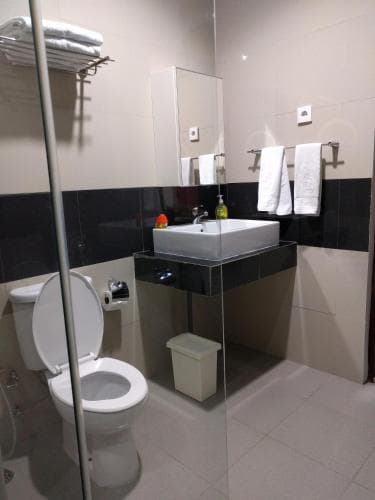 Hotel The Ramelau modern bathroom with vanity, mirror and toilet