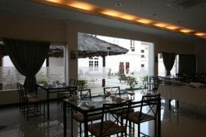 Hotel The Ramelau bright breakfast room with elegant table settings