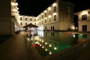 Hotel The Ramelau illuminated courtyard pool flanked by hotel wings at night