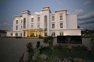 Hotel The Ramelau grand white facade lit at twilight