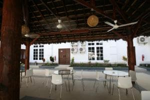 Hotel The Ramelau covered courtyard with timber ceiling and white seating