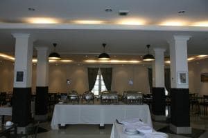 Hotel The Ramelau suite lounge with grey sectional sofa