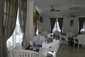 Hotel The Ramelau bedroom with king bed and french doors to balcony
