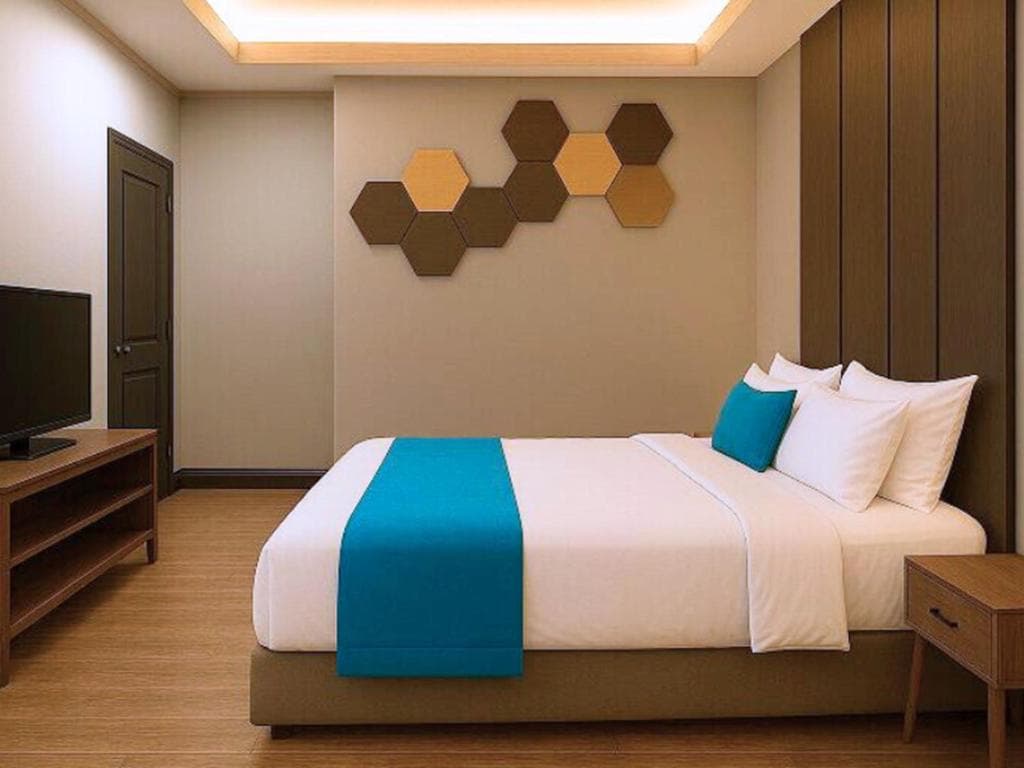 Suite with Terrace — bedroom with hexagonal wall art and king bed