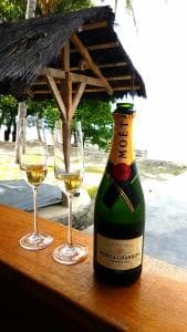 Lauhata Beach Escape welcome champagne in a thatched gazebo by the beach