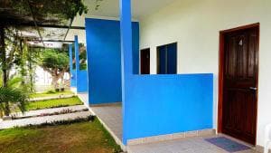 Lauhata Beach Escape blue-painted bungalow exterior with timber door