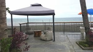 Lauhata Beach Escape oceanfront gazebo with seating and ocean view