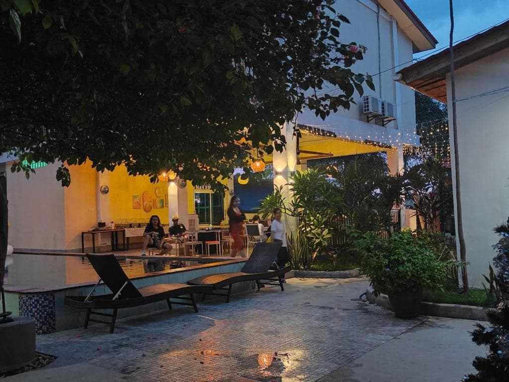 M Y Hotel evening patio with string lights and outdoor dining