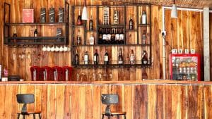 M Y Hotel timber bar with bottle display and stool seating