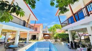 M Y Hotel two-storey courtyard with pool and balconies in daylight