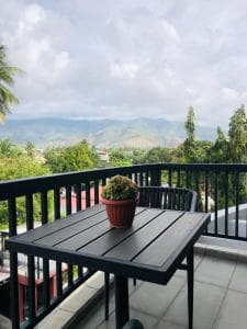 Palm Beach Hotel Dili apartment lounge with leather sofas and ceiling fan