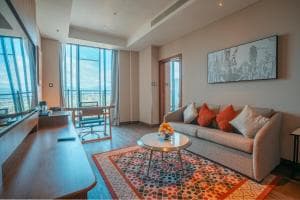 Palm Springs Hotel suite living area with grey sofa and patterned rug