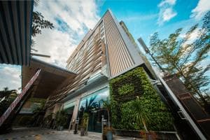 Palm Springs Hotel modern facade with vertical garden and entrance canopy