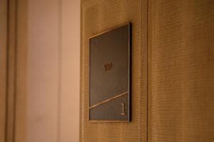 Palm Springs Hotel guestroom door plaque with brand logo