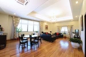 Plaza Hotel Dili family suite with dining table and lounge area