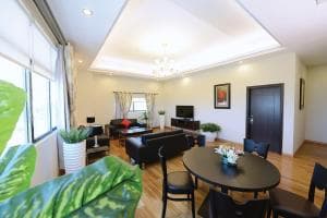 Plaza Hotel Dili suite living and dining area with sofa and table